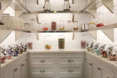 Photo of a traditional kitchen pantry in New York with subway tile splashback.
