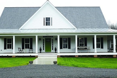 This is an example of a large farmhouse screened-in back porch design in DC Metro with decking.