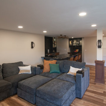 Traditional Style Basement Remodel, Accented by New Bar Area With Warmer Tones