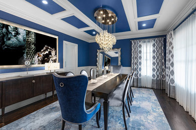 Example of a mid-sized beach style dark wood floor and brown floor enclosed dining room design in New York with blue walls and no fireplace
