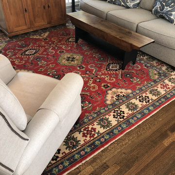 Warm your neutral lving room space with a color pop from your rug!