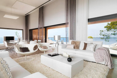 Inspiration for a contemporary open concept living room in Barcelona with white walls.