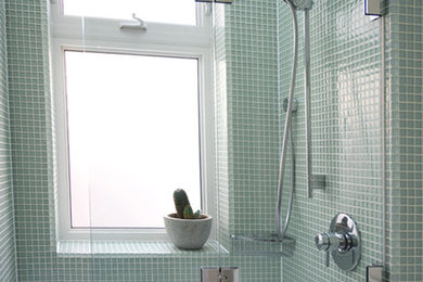 Mid-sized traditional 3/4 bathroom in Toronto with glass tile, a shower/bathtub combo, an alcove tub, green tile, green walls and a hinged shower door.