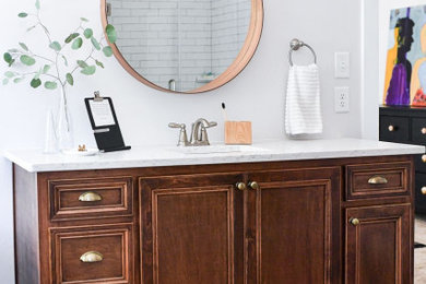 Inspiration for a large rustic master ceramic tile, gray floor, single-sink and wallpaper ceiling bathroom remodel in Atlanta with recessed-panel cabinets, medium tone wood cabinets, an undermount sink, quartz countertops, white countertops and a built-in vanity