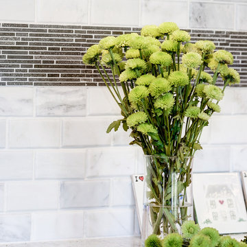White Kitchen Remodel with Colonial White Granite and Stainless Steel Appliances
