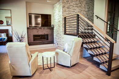 Living room - mid-sized industrial formal and open concept porcelain tile and beige floor living room idea in Denver with white walls, a standard fireplace, a metal fireplace and a wall-mounted tv