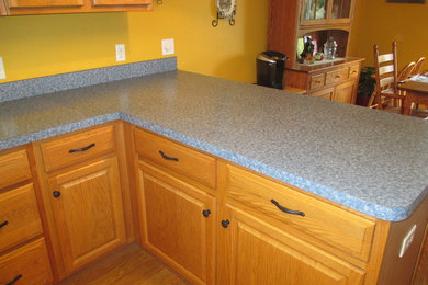 Kitchen - traditional kitchen idea in Other with laminate countertops