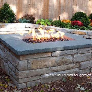Fire pit and stone retaining wall