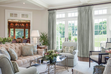 Mid-sized enclosed dark wood floor and brown floor living room photo with beige walls, no fireplace and no tv