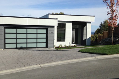 Inspiration for a mid-sized contemporary gray one-story concrete exterior home remodel in Vancouver