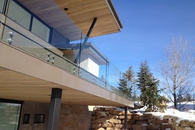 Design ideas for a large contemporary two-storey glass brown exterior in Salt Lake City.