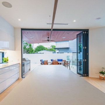 Blue Bi fold Door connecting inside and outside