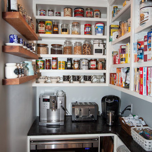 Mid-sized farmhouse kitchen pantry ideas - Inspiration for a mid-sized country l-shaped medium tone wood floor kitchen pantry remodel in Philadelphia with shaker cabinets, white cabinets, marble countertops, white backsplash, subway tile backsplash, stainless steel appliances and an island