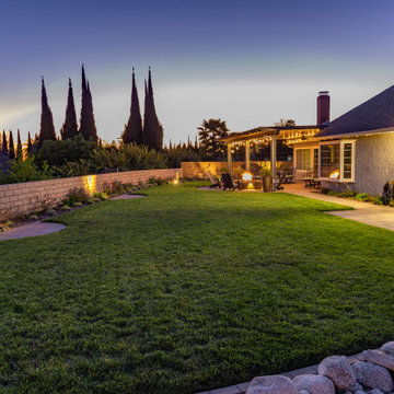 Backyard Patio with Spacious Lawn & Dry Stream Bed