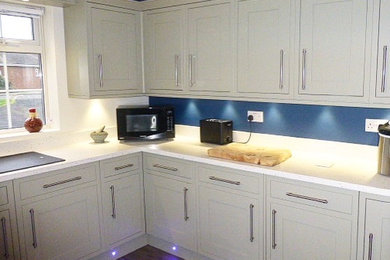 Modern kitchen in Sussex with composite countertops.
