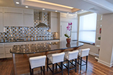 Eat-in kitchen - mid-sized contemporary single-wall medium tone wood floor eat-in kitchen idea in Chicago with a double-bowl sink, flat-panel cabinets, white cabinets, metal backsplash, stainless steel appliances, an island, granite countertops and metallic backsplash