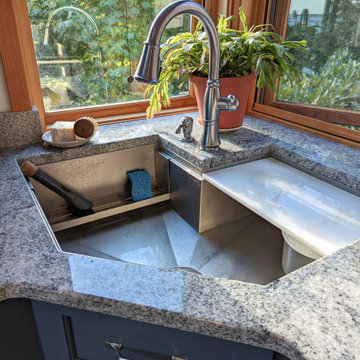 Custom Stainless Corner Workstation Sink in a Blue Kitchen