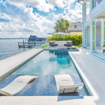 Luxury Waterfront Outdoor Lounge With Infinity Pool and Elegant Design
