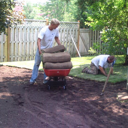 Sod Installation - Harmony Gardens team at work - Bulbs And Seeds