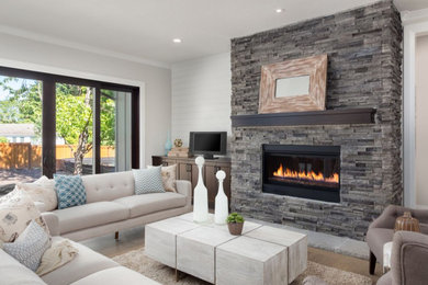 Inspiration for a mid-sized timeless open concept light wood floor and brown floor living room remodel in Other with white walls, a standard fireplace and a brick fireplace