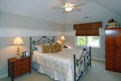 Bedroom - mid-sized traditional carpeted bedroom idea in Other with gray walls and no fireplace