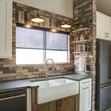 The designer client selected black stainless appliances with copper accents that
