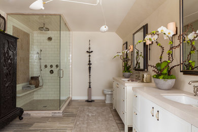 Mid-sized master bathroom photo in Chicago with white cabinets, beige walls, an undermount sink and a hinged shower door