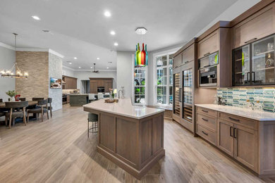 Large trendy galley porcelain tile and beige floor seated home bar photo in Miami with an undermount sink, shaker cabinets, medium tone wood cabinets, quartz countertops, multicolored backsplash, ceramic backsplash and beige countertops