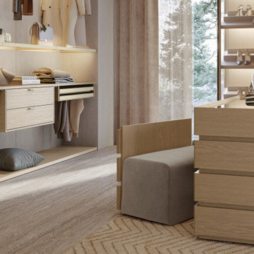 Walk in Closet Featuring Tall Glass Framed Cabinets