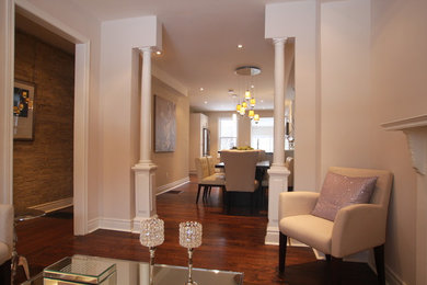Mid-sized elegant formal and open concept dark wood floor living room photo in Toronto with beige walls, a standard fireplace, a tile fireplace and no tv