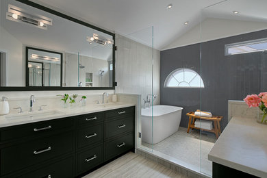 Bathroom - large contemporary master gray tile and porcelain tile porcelain tile, beige floor, double-sink and vaulted ceiling bathroom idea in Chicago with flat-panel cabinets, black cabinets, gray walls, an undermount sink, quartzite countertops, beige countertops and a built-in vanity