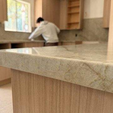 Taj Mahal Quartzite Peninsula Kitchen, Maple Cabinets