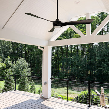 Two Story Covered Porch & Trex Deck with Trex Rain Escapes Underpinning
