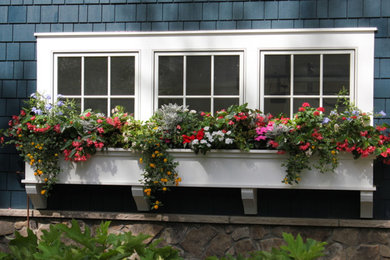 Photo of a small traditional full sun side yard formal garden in Other for spring.