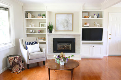 Transitional living room in Other with beige walls and a wall-mounted tv.
