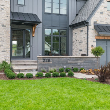 Modern Stone and Siding Farmhouse