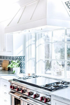 Stove hood in front of window