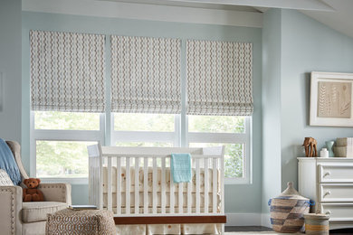 Mid-sized transitional gender-neutral dark wood floor and brown floor nursery photo in Other with gray walls