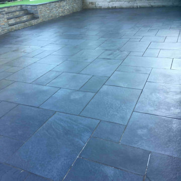 Acid Damaged and Painted Black Limestone Patio Renovated in Sandbach