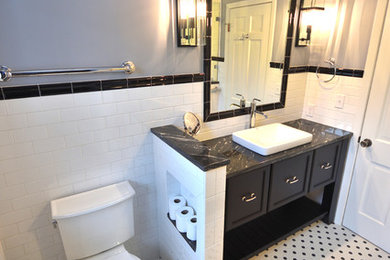 Alcove shower - mid-sized mid-century modern master white tile and subway tile mosaic tile floor and multicolored floor alcove shower idea in Other with furniture-like cabinets, black cabinets, a two-piece toilet, purple walls, a vessel sink, granite countertops, a hinged shower door and black countertops