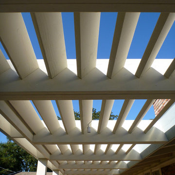 Louvered arbor top to direct light away from windows.