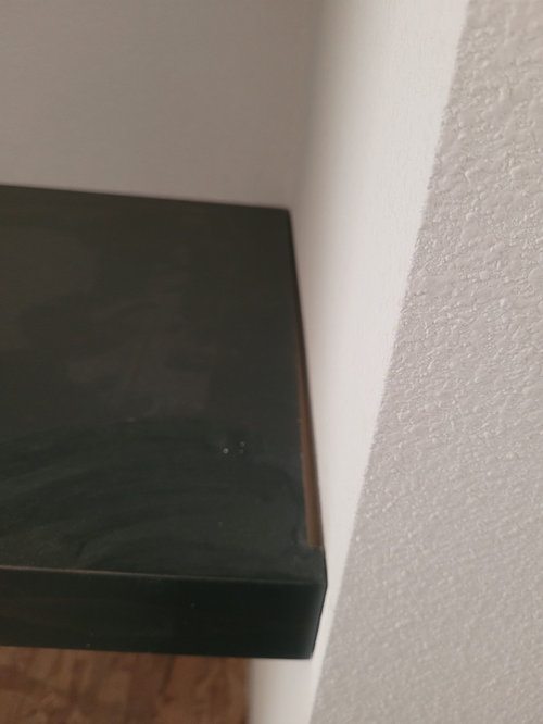Gaps between built in shelves and wall