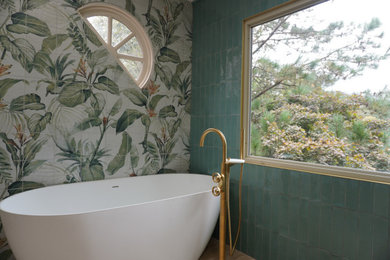 Example of a large minimalist master green tile and porcelain tile wood-look tile floor, beige floor and double-sink bathroom design in Richmond with medium tone wood cabinets, a two-piece toilet, green walls, an undermount sink, quartz countertops, a niche and a freestanding vanity