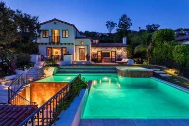 Large beach style backyard custom-shaped hot tub photo