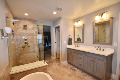 Inspiration for a large transitional master gray tile and stone tile travertine floor bathroom remodel in Denver with recessed-panel cabinets, gray cabinets, an undermount sink and quartz countertops