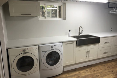 Inspiration for a large contemporary dedicated laundry room remodel in Toronto