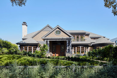 Mountain style brown two-story house exterior photo in Los Angeles with a gray roof