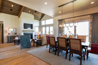 Large mountain style light wood floor kitchen/dining room combo photo in Salt Lake City with white walls and a standard fireplace