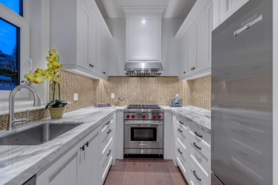Kitchen - huge traditional u-shaped kitchen idea in Vancouver