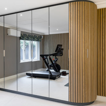 BESPOKE MIRRORED CABINETRY AND WALL PANELLING FOR A LUXURY HOME GYM